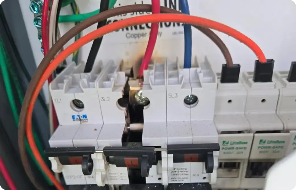 Electrical wires connect to power boxes
